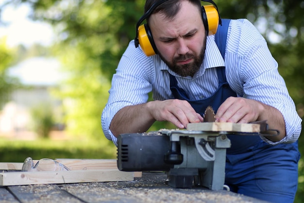 Beard man working on Circular saw