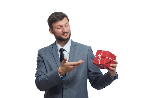 Bearded businessman holding a present