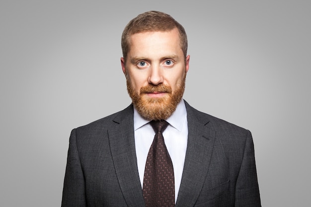 Bearded businessman looking at camera. studio shot isolated on white.