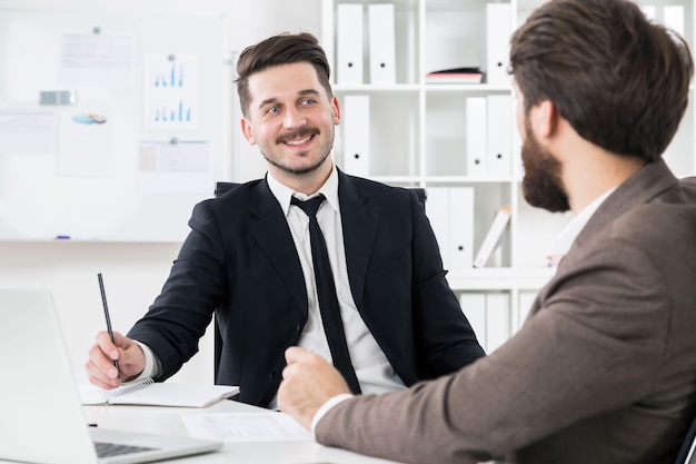 Bearded businessmen discussing something