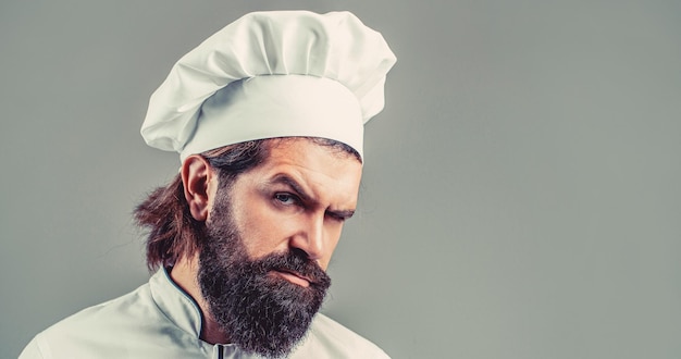 Bearded chef cooks or baker Bearded male chefs isolated Serious cook in white uniform chef hat Portrait of a serious chef cook