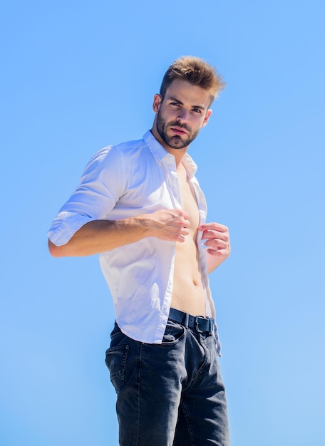 Bearded guy business style Handsome man fashion model Muscular torso Muscular sexy macho man Attractive torso Hot day outdoors Attractive man taking off shirt Confident in his appealing