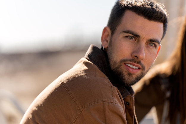 Bearded guy in outerwear on street