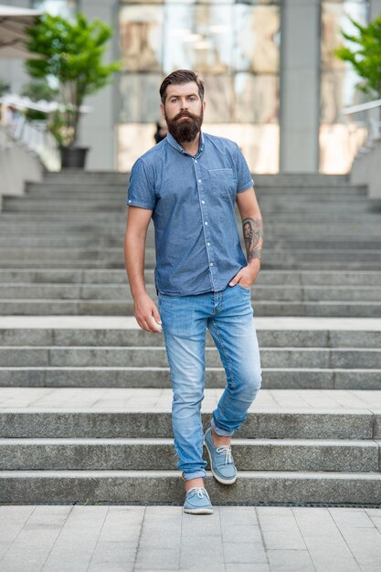 Bearded guy walk downstairs full length of guy with beard hipster guy outdoor