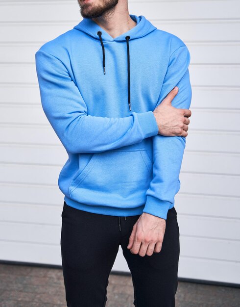 Bearded guy wears blue hoodie no logo color hoodie clothing line mock up