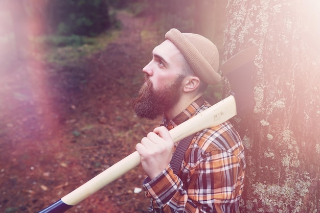 A bearded lumberjack with a large ax