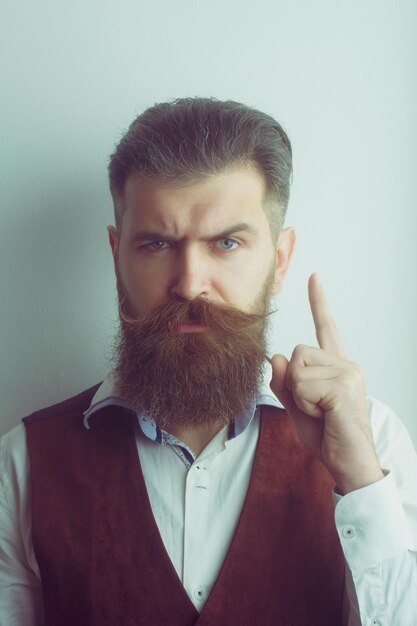 Bearded man brutal caucasian hipster with serious face