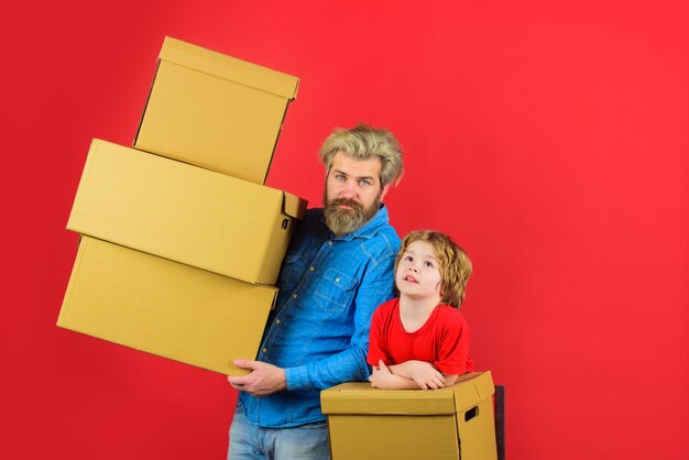 Bearded man carry boxes delivery delivery mail shipment son and father with cardboard box internet