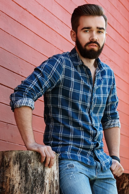 Bearded man in checkered shirt