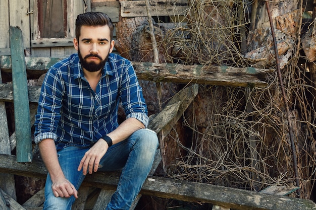 Bearded man in checkered shirt