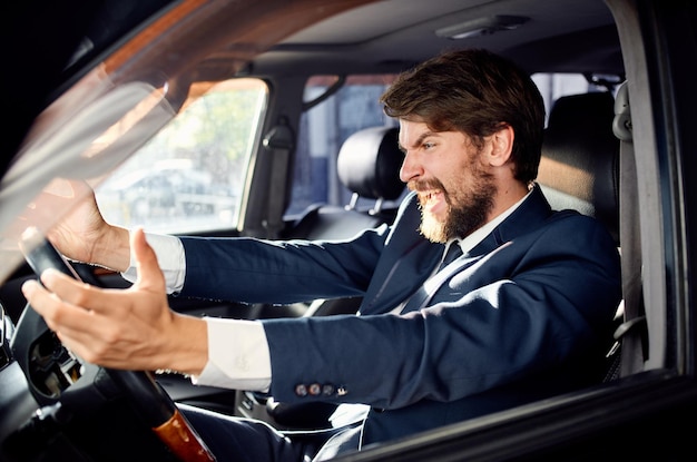 Bearded man Driving a car trip luxury lifestyle rich High quality photo