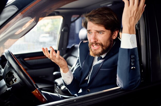 Bearded man driving a car trip luxury lifestyle success. high\
quality photo