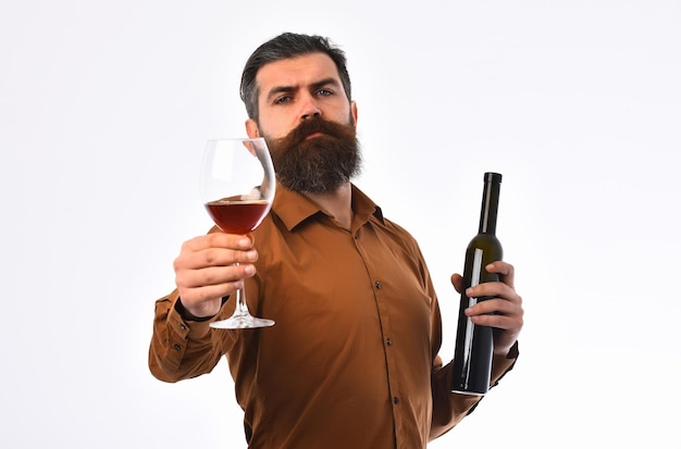 Bearded man hipster with wine bottle, glass in brown shirt