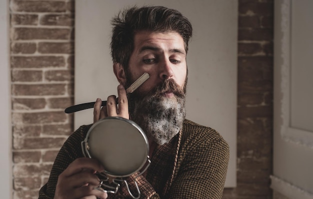 Bearded man home beard style portrait of stylish man beard barber straight razor barbershop vintage