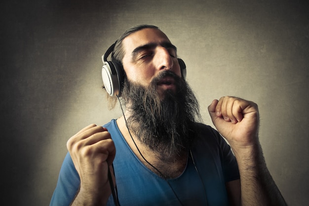 bearded man listening to music
