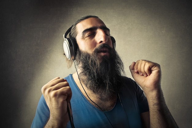 Bearded man listening to music