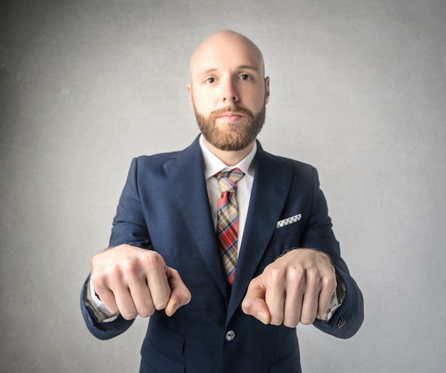 Bearded man playing fist hiding game