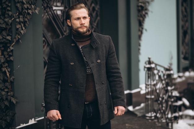 Bearded man posing in the street in winter