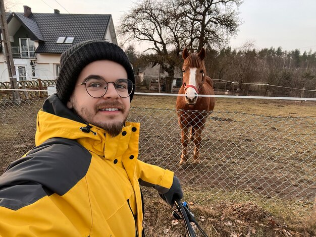 Bearded man selfie with the horse