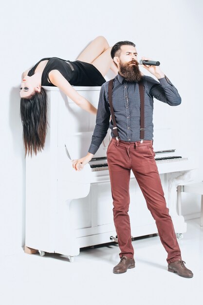 Bearded man singing and woman