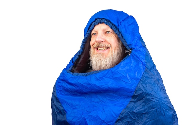 bearded man in a sleeping bag on a white background equipment for recreation in tourism and travel