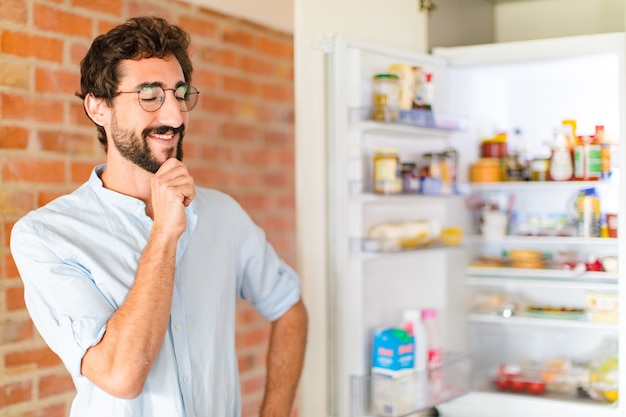 Bearded man smiling with hand on chin