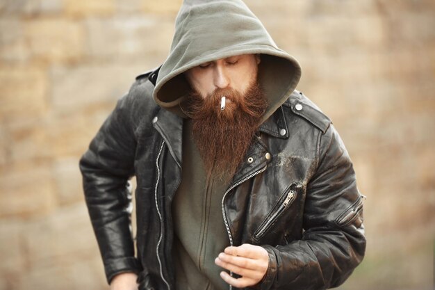 Bearded man smoking weed outdoors