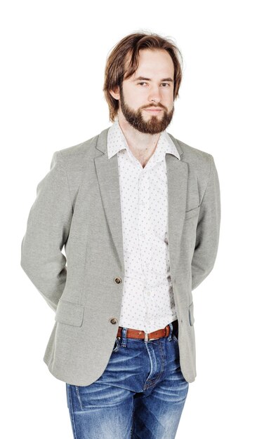 Bearded man standing and looking at camera human emotion expression and lifestyle concept image on a white studio background