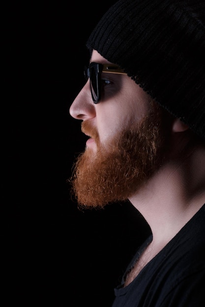 Bearded man in sunglasses and hat