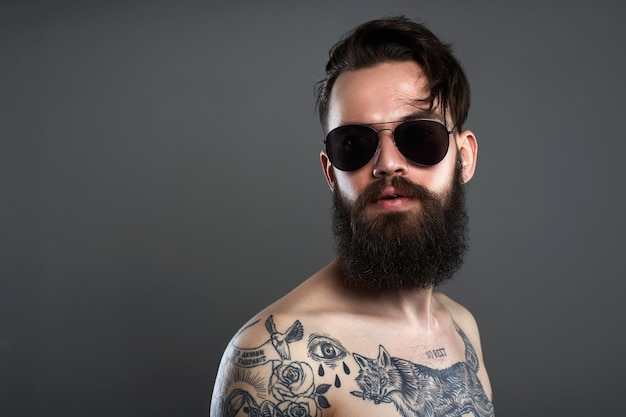 bearded man in sunglasses naked tattoed young male body