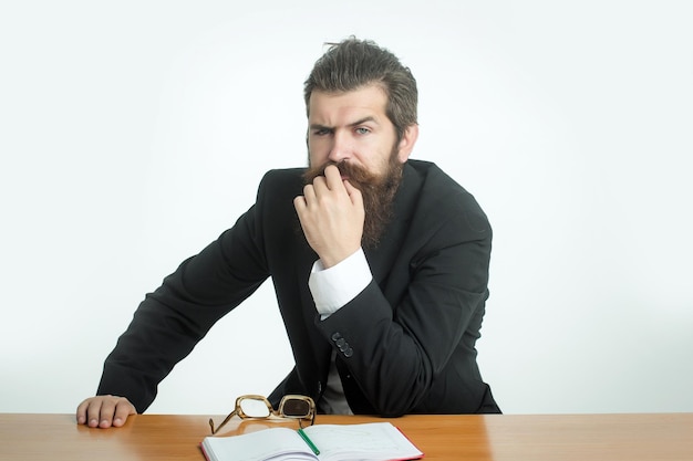 Bearded man teacher at table