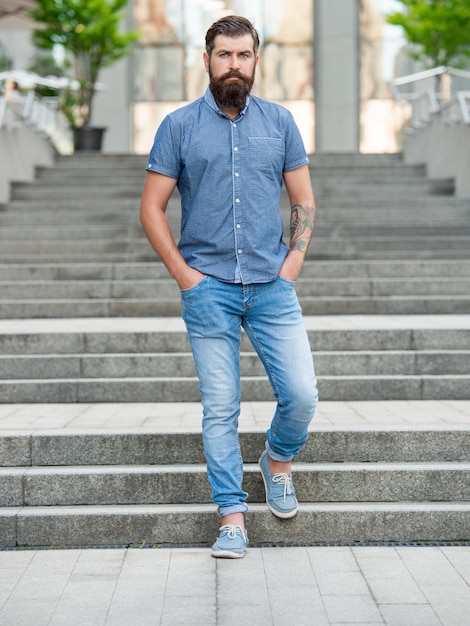 Bearded man walk downstairs full length of man with beard hipster man outdoor