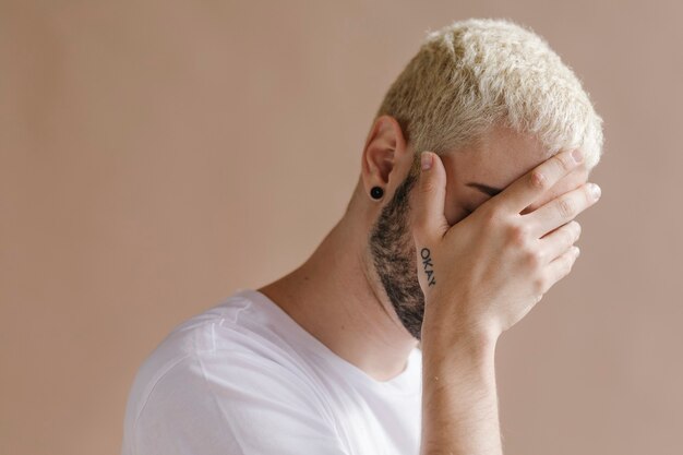 Bearded man in a white tee