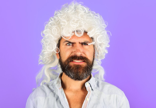 Bearded man in white wig. Barbershop concept. Handsome Male in periwig.