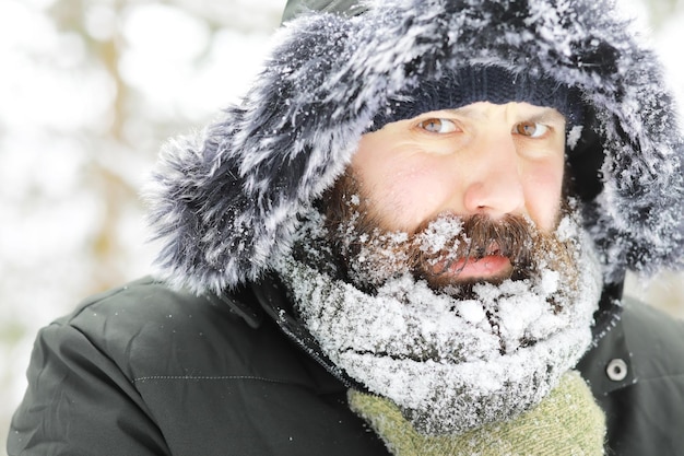 Bearded man in the winter woods attractive happy young man with\
beard walk in the park