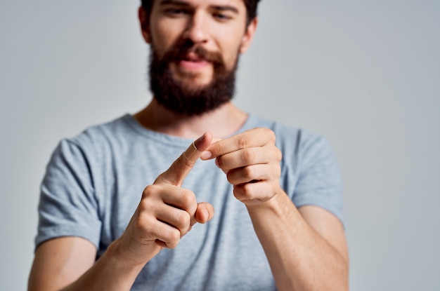 Bearded man with bandaged finger injury treatment