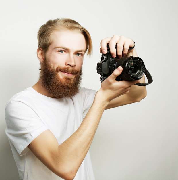 Bearded man with a digital camera