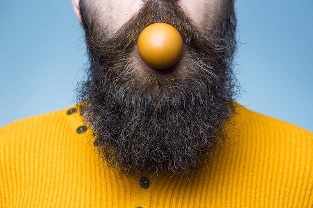 Bearded man with egg