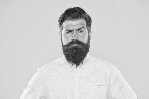 Bearded man with hairstyle in white shirt male fashion