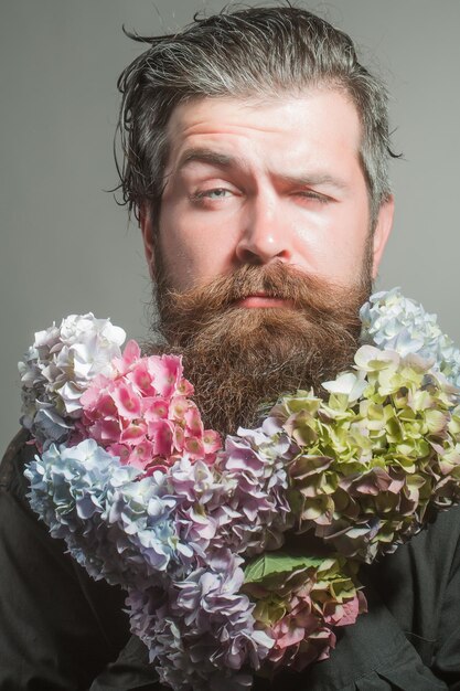 Bearded man with hydrangea flowers