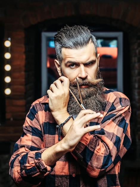 Bearded man with scissors