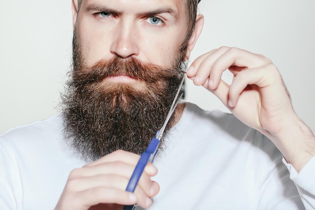 Bearded man with scissors