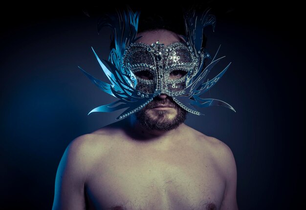 bearded man with silver mask Venetian style. Mystery and renaissance