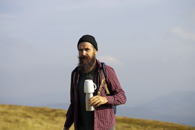 Bearded man with thermos