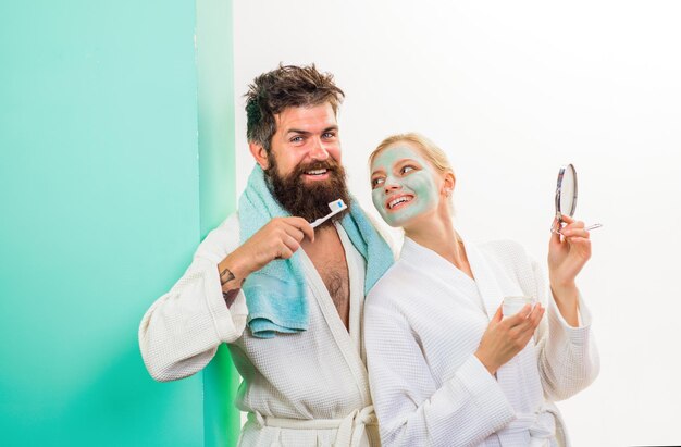 Bearded man with toothbrush cosmetic facial mask morning treatments health morning routine family