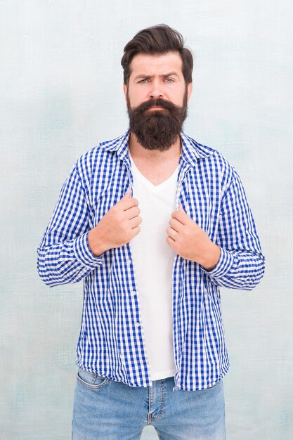 Bearded man with trendy beard hair in casual fashion style, brutal.