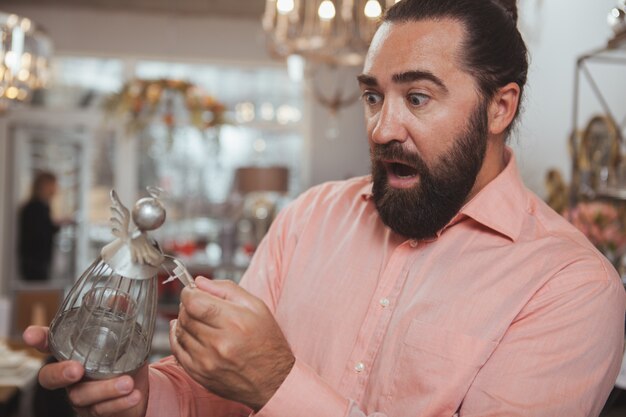 Bearded mature man shopping at home goods store