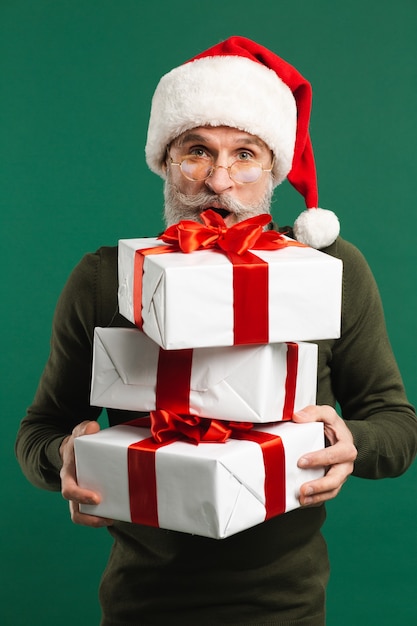 Bearded modern Santa Claus holding gifts