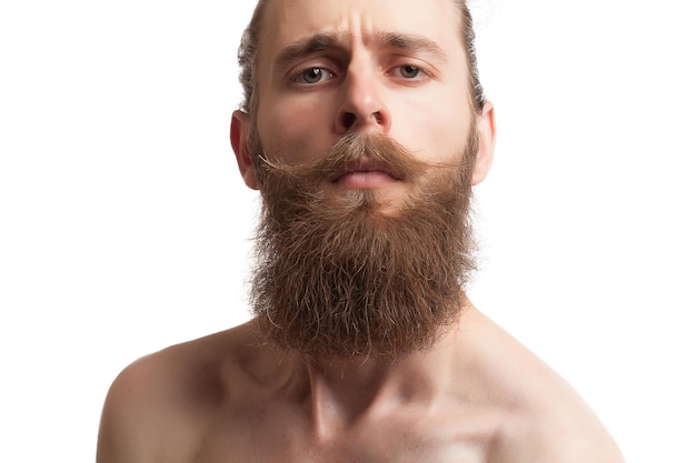 Bearded tattooed hipster on white background in studio photo