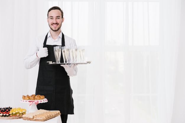 Bearded waiter showing approval